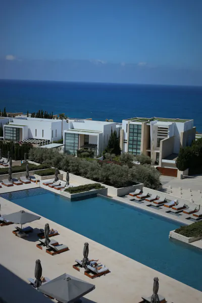 Aerial view of a luxury resort with a large infinity pool overlooking the sea in Paphos, Cyprus
