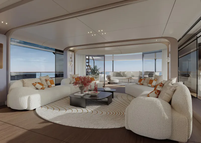 Modern luxury yacht lounge with white curved sofas, orange pillows, round coffee table, and panoramic ocean views through large windows