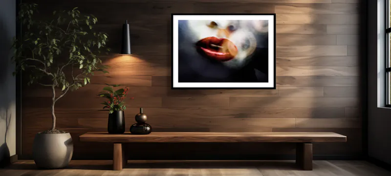 Modern wooden bench with potted tree and vases beneath framed abstract art of red lips on wood-paneled wall