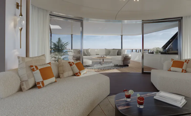 Luxury yacht living room with white sofas, orange pillows, and open glass doors overlooking the ocean