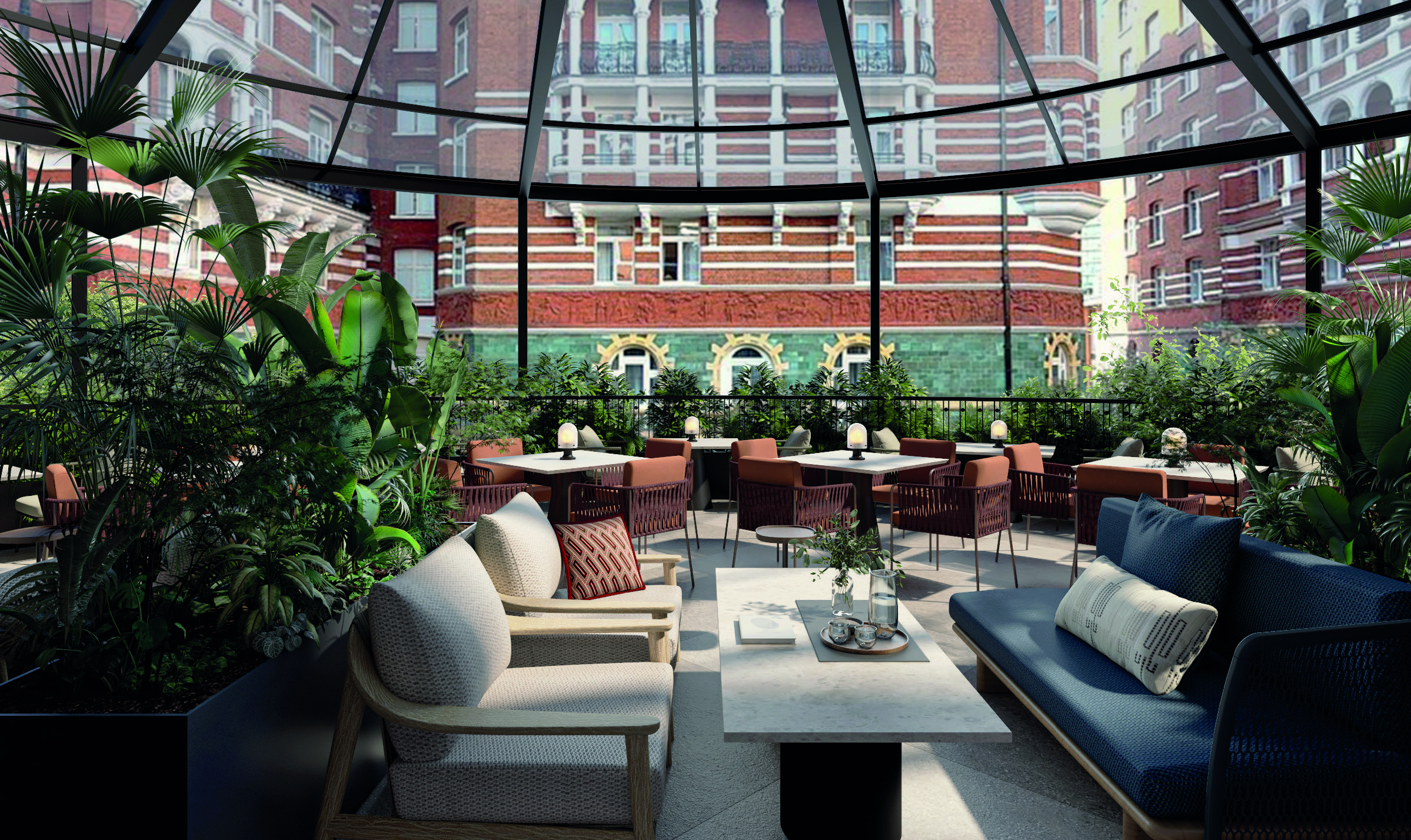Elegant rooftop lounge at St James’ Court, a Taj Hotel, with lush plants, modern seating, and views of historic red-brick buildings