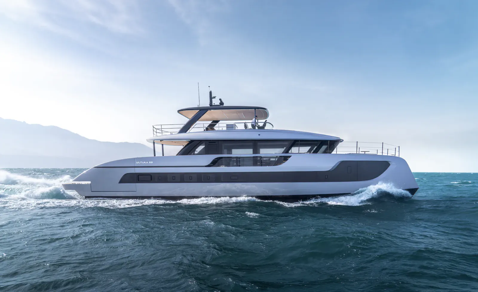 Sunreef Ultima 88 luxury yacht cruising on open sea under clear blue sky