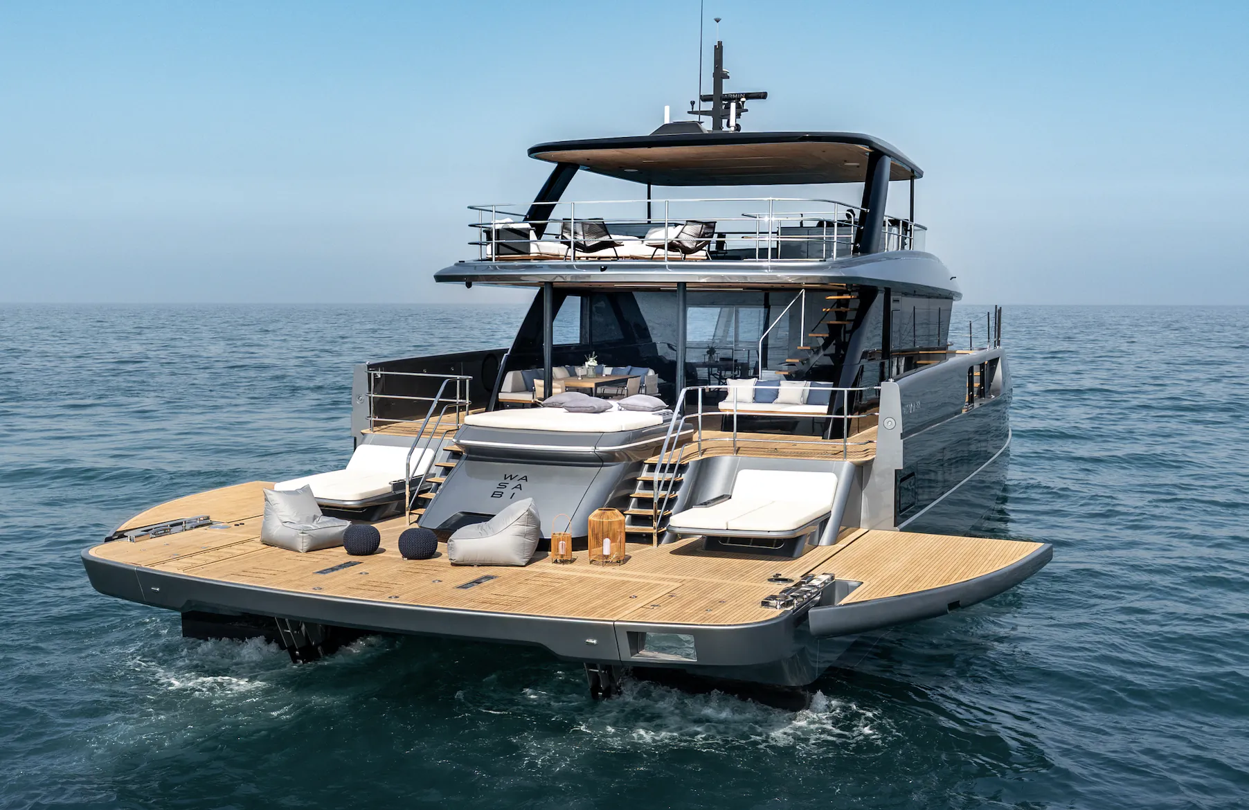 Sunreef Ultima 88 luxury yacht with spacious teak deck, lounge seating, and flybridge on open sea